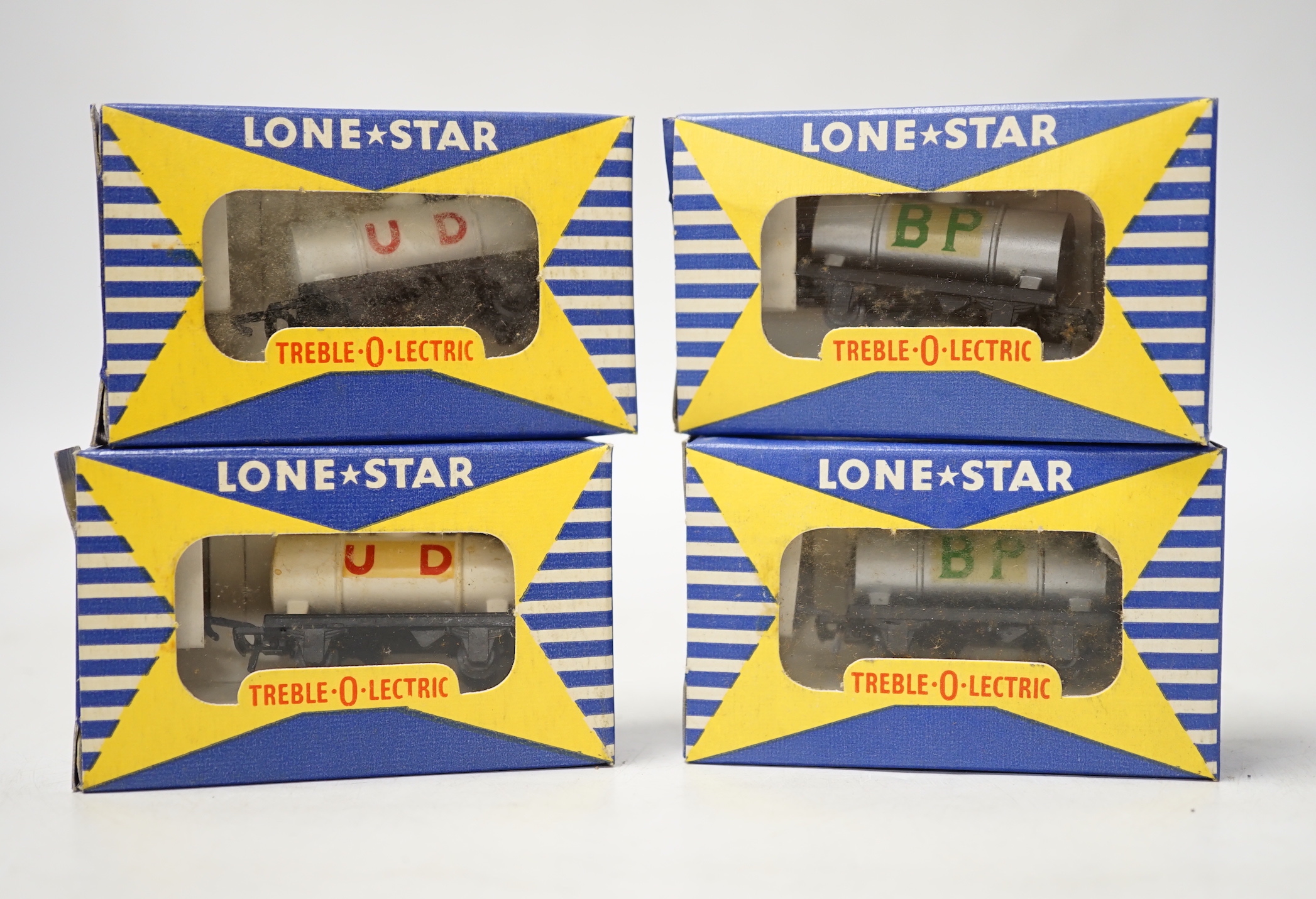 A collection of boxed Lone Star 000 gauge model railway, contained within two original trade boxes with most items, appearing boxed as new, comprising Shell Oil wagons, petrol tank wagons, milk tank wagons, etc. (144 ite
